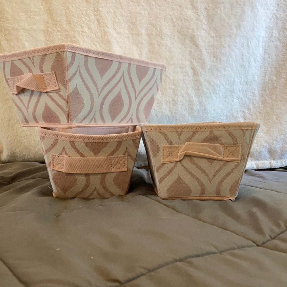 pink and white storage bins